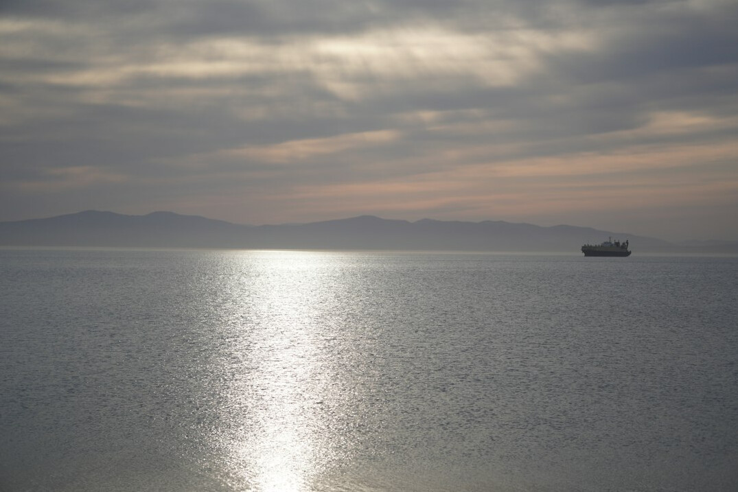 Calm sea coast at sunrise with soft light