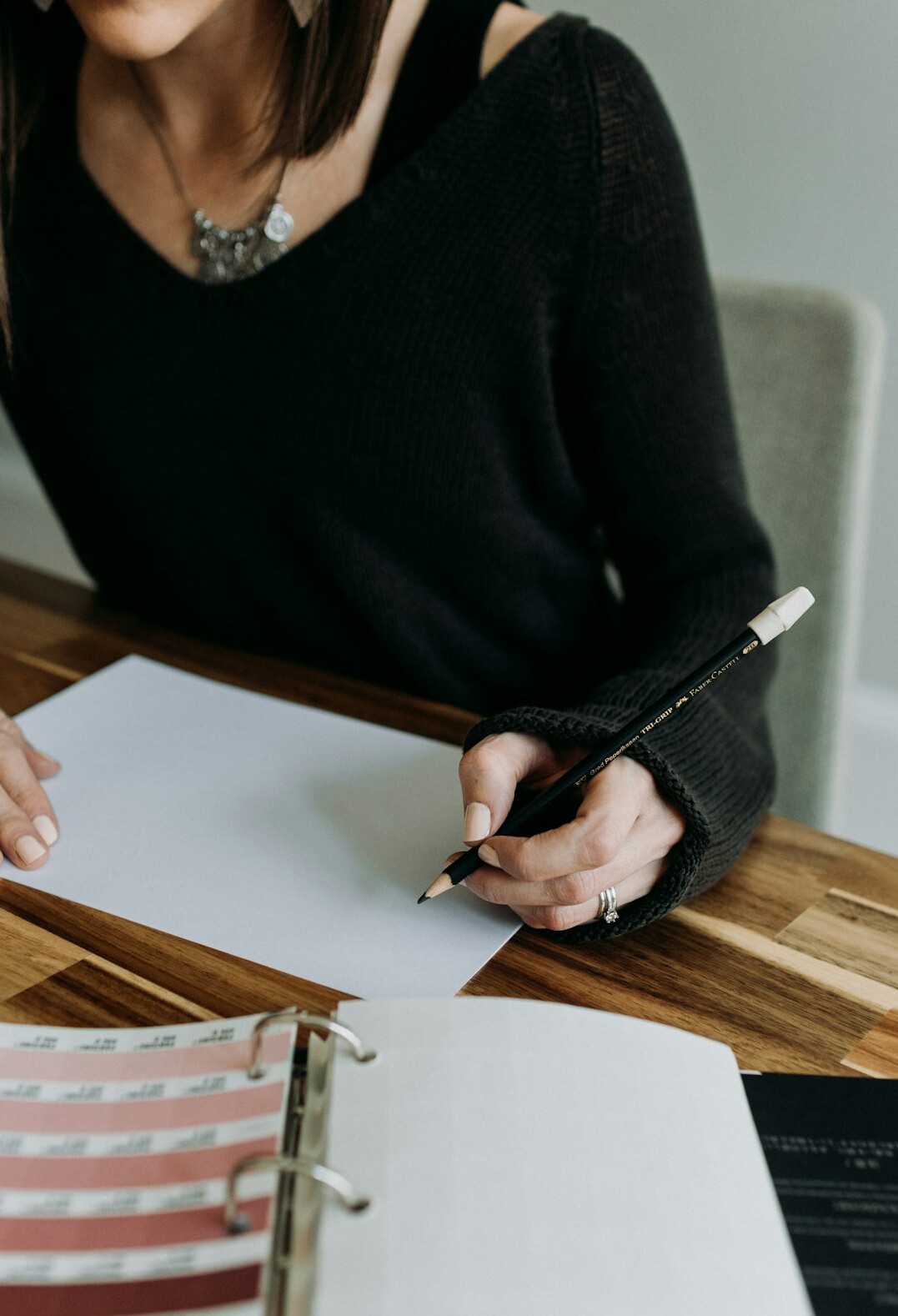 woman writing budget plan