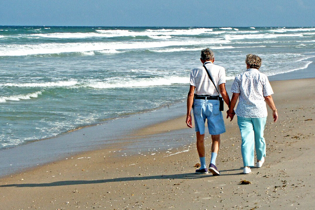 retired couple on beach